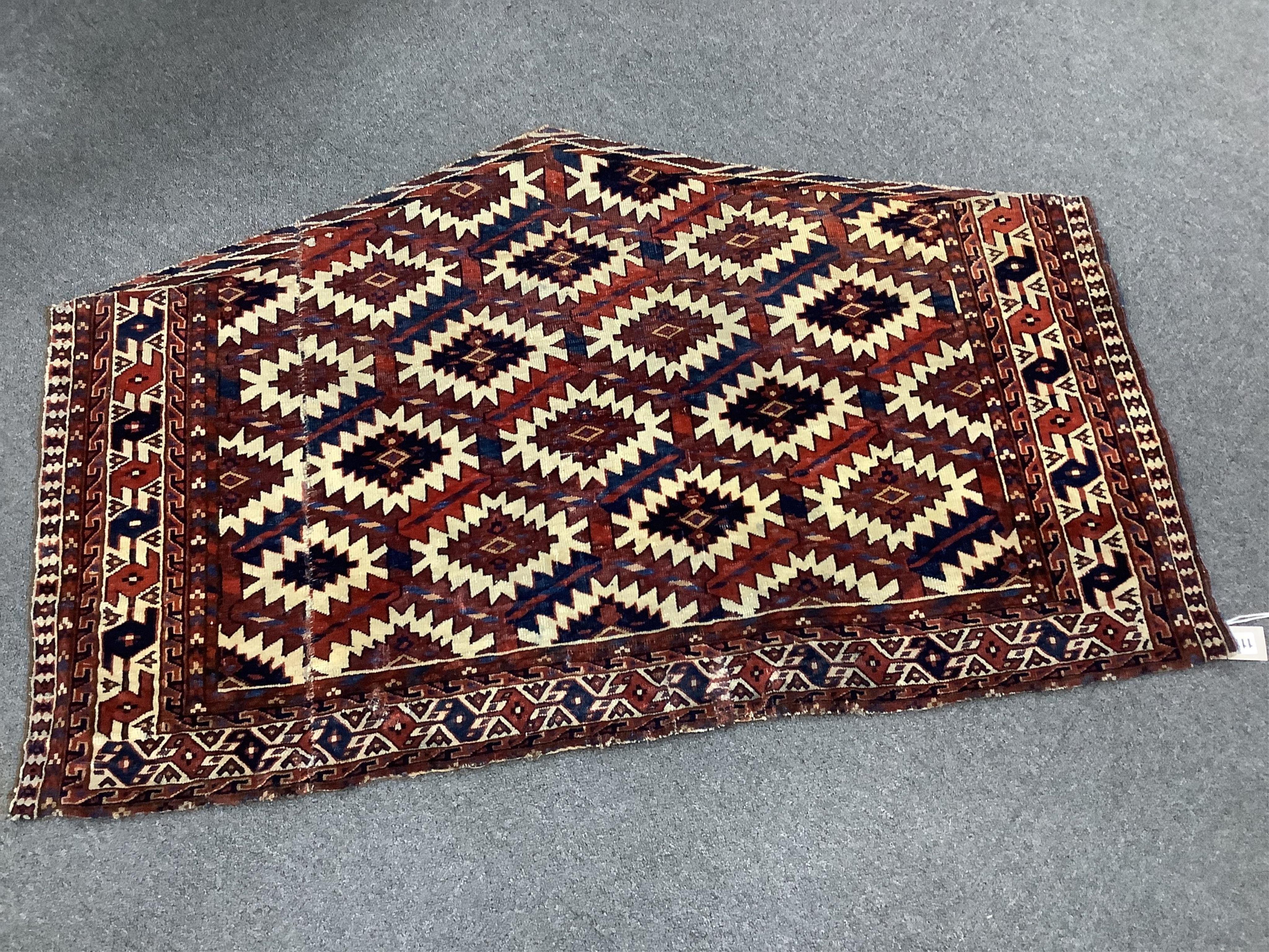 An antique Asmalyk tent door hanging, width 121cm, height 75cm. Condition - fair